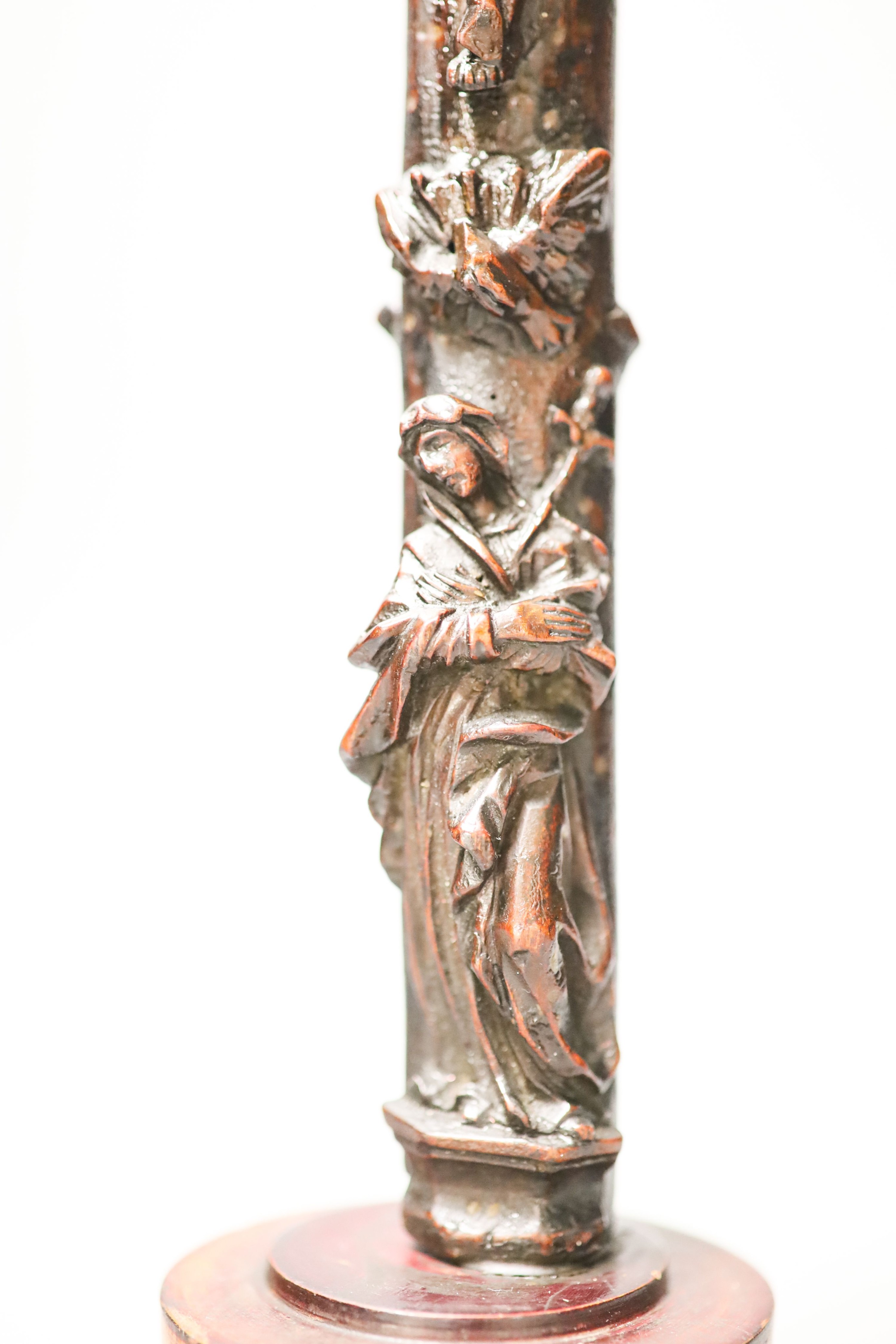 A carved wood crucifix 33cm